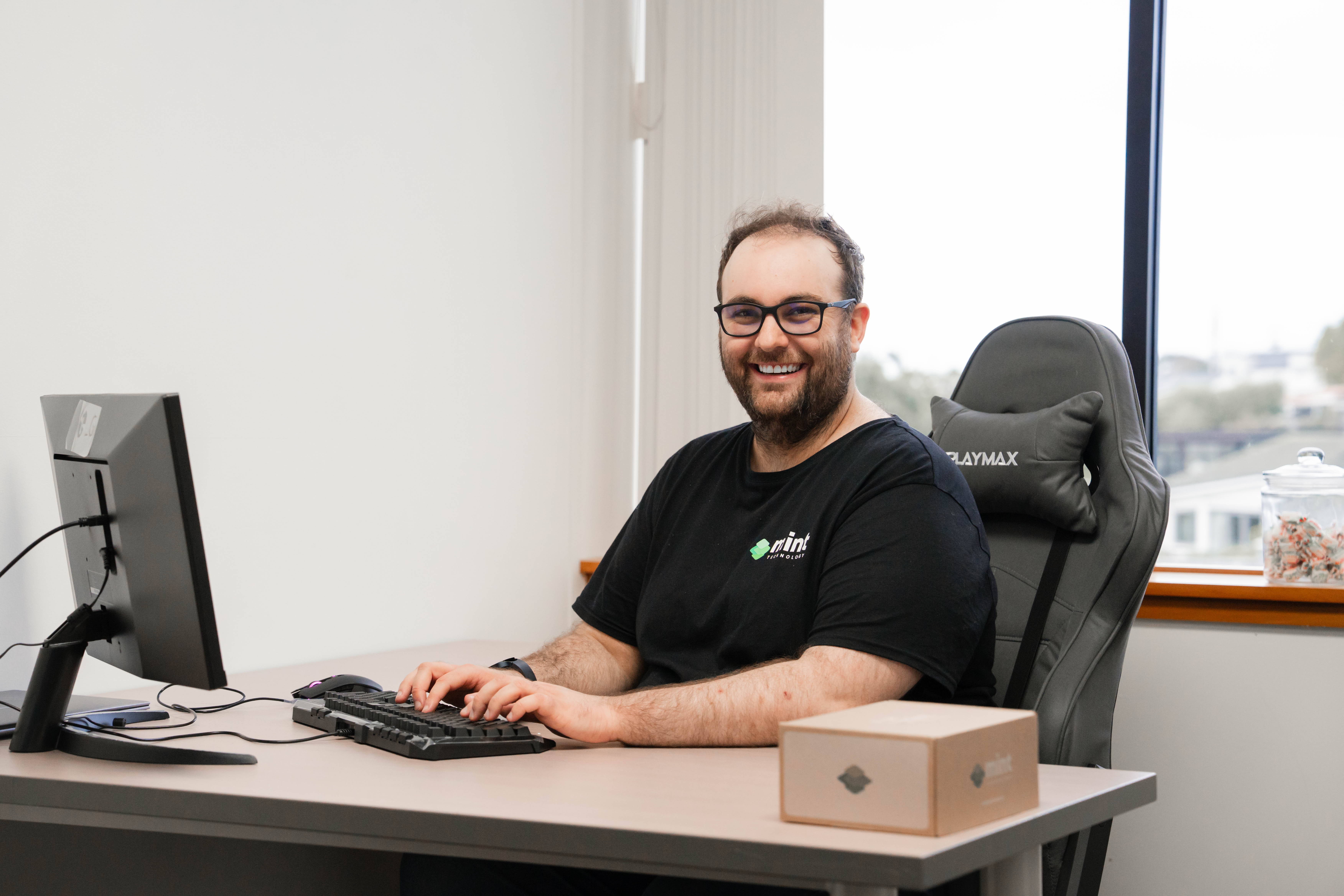 Mint team member at work in Birkenhead office